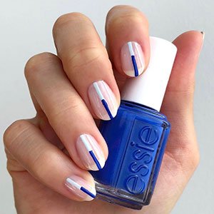 Consigue este diseño de uñas geométricas con línea bicolor utilizando los esmaltes de secado rápido de Expressie. 